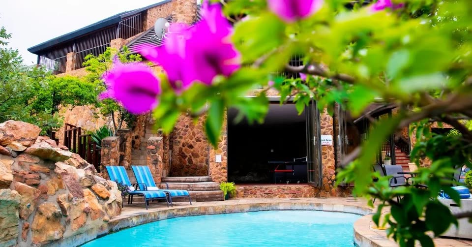 Freeman House Recovery: Luxury residential villa, swimming pool, and manicured gardens in Hartbeespoort, South Africa
