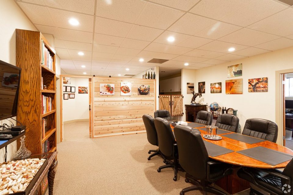 Golden Gate Recovery: Group therapy and clinical conference room with wood accent wall in Suite 220
