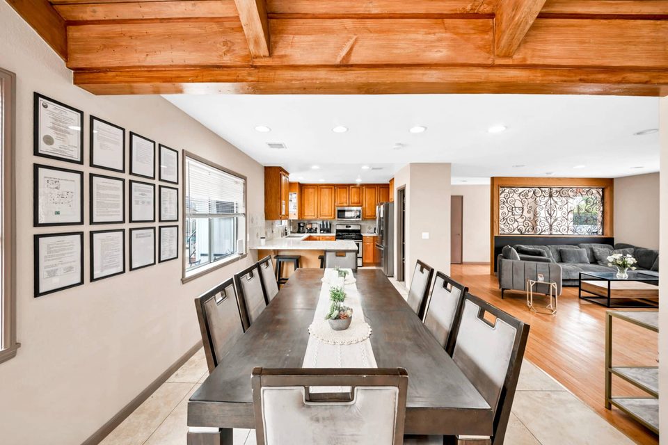 Northridge Addiction Treatment Center: Communal dining table and state license display wall inside the Northridge residence