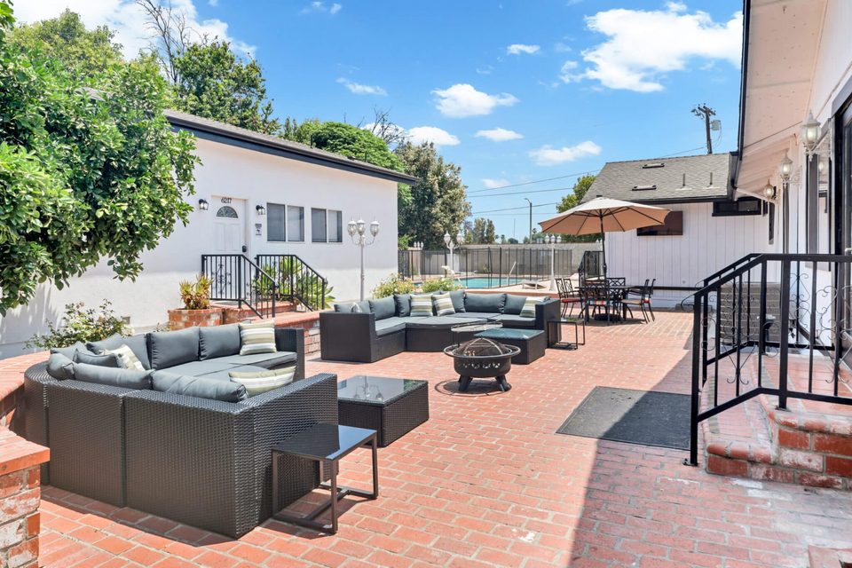 Northridge Addiction Treatment Center: Brick courtyard with outdoor sectional seating and fire pit